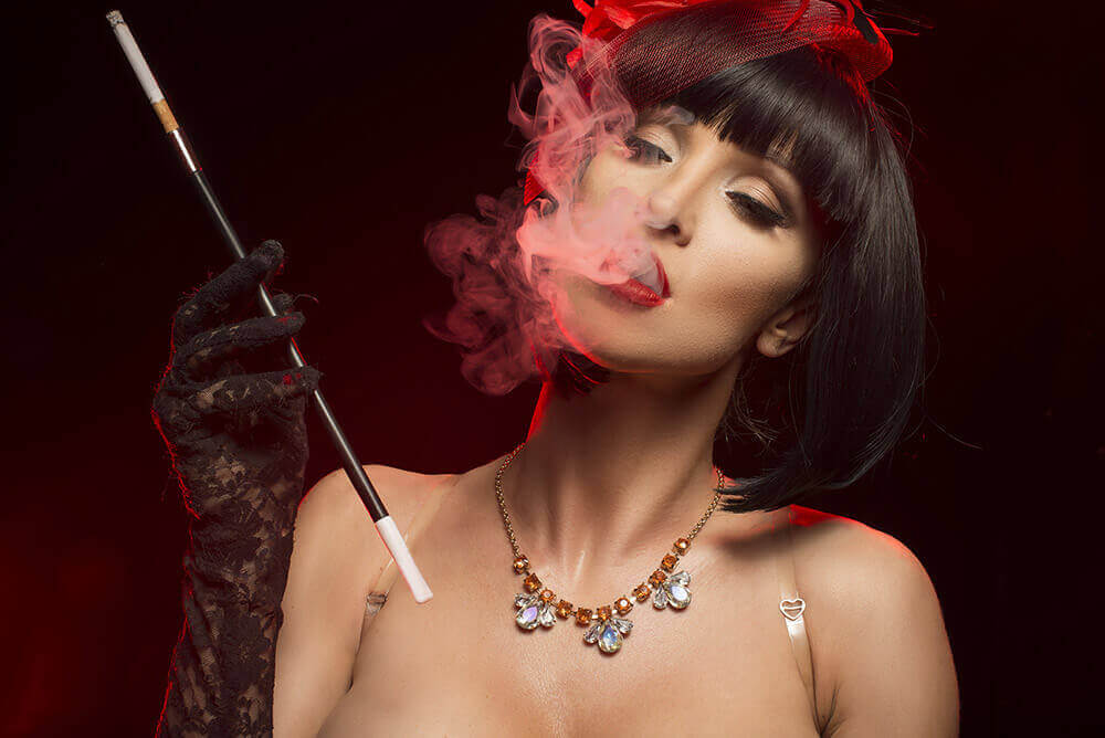 Sexy dancer smoking a cigarette
